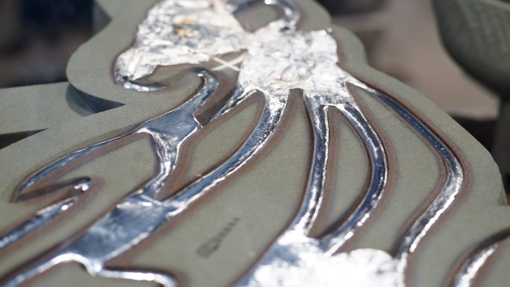 Liquid metal poured into a 3D printed sand cast. Photo via Dezeen/ETH Zurich