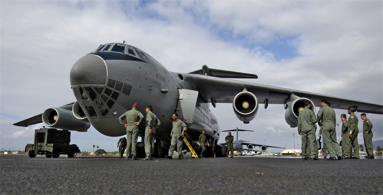 Airmen wait to board a cargo aircraft. Photo via U.S. Air Force/Tech. Sgt. Shane A. Cuomo.