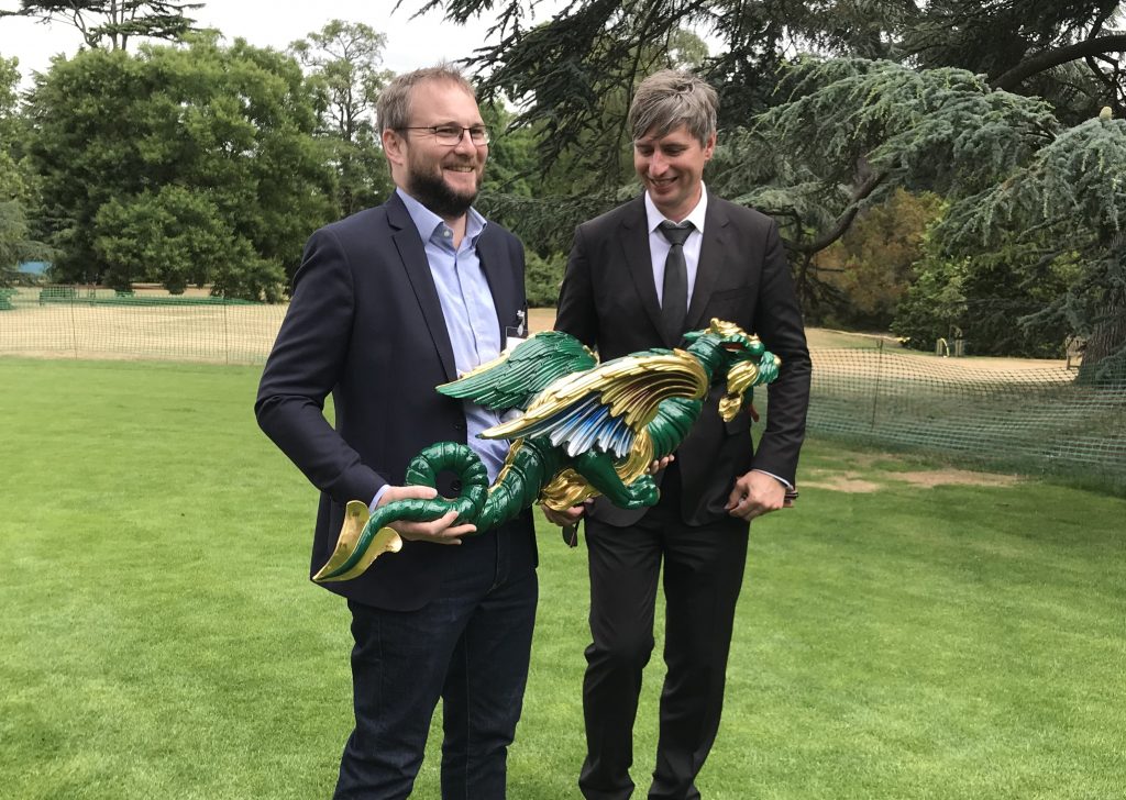 Nick Lewis, General Manager On Demand Manufacturing, 3D Systems (left) and Craig Hatto, Project Lead at HRP (right) holding one of the finished 3D printed dragons. Photo by Beau Jackson