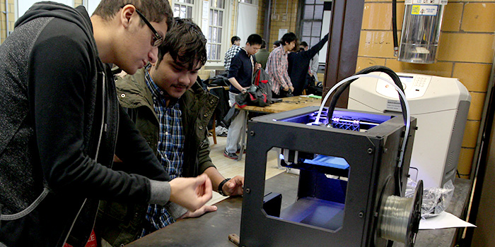 Students learning about 3D printing. Photo via RobotLab.