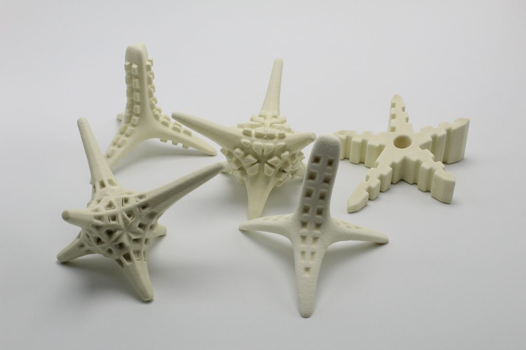 Multiple 3D printed seeding unit designs. Photo via SECORE International