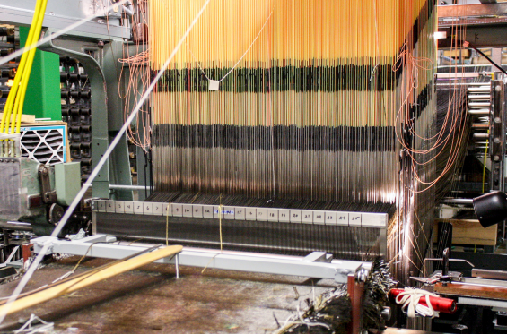 HEEET material for future missions will be woven with a new 24-inch loom that is capable of weaving dual layer HEEET material 24 inches wide at thicknesses of 2 inches and greater. Photo via NASA.