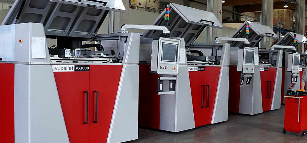 Line of voxeljet VX1000 3D printers. Photo via voxeljet
