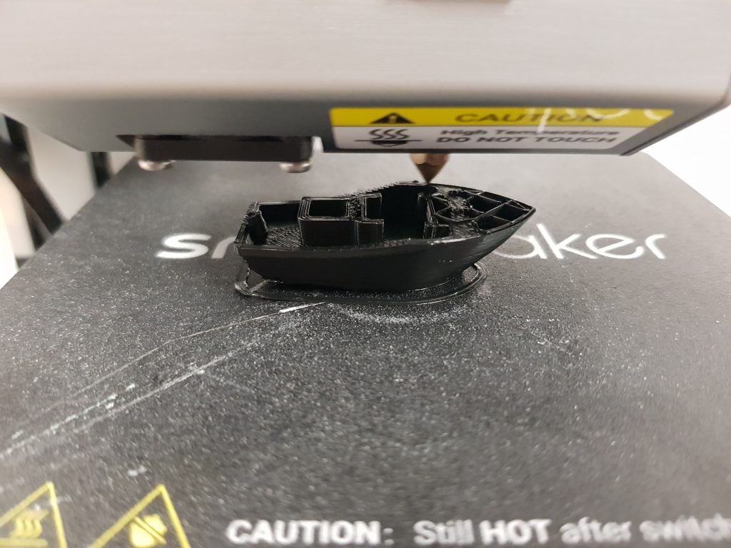 Calibration 3DBenchy boat in Amazon Basics Black PLA on a Snapmaker 3D printer. Photo by 3D Printing Industry