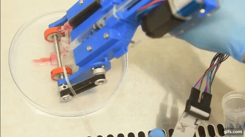 The handheld 3D bioprinter depositing skin cells onto a substrate.Clip via UoT.