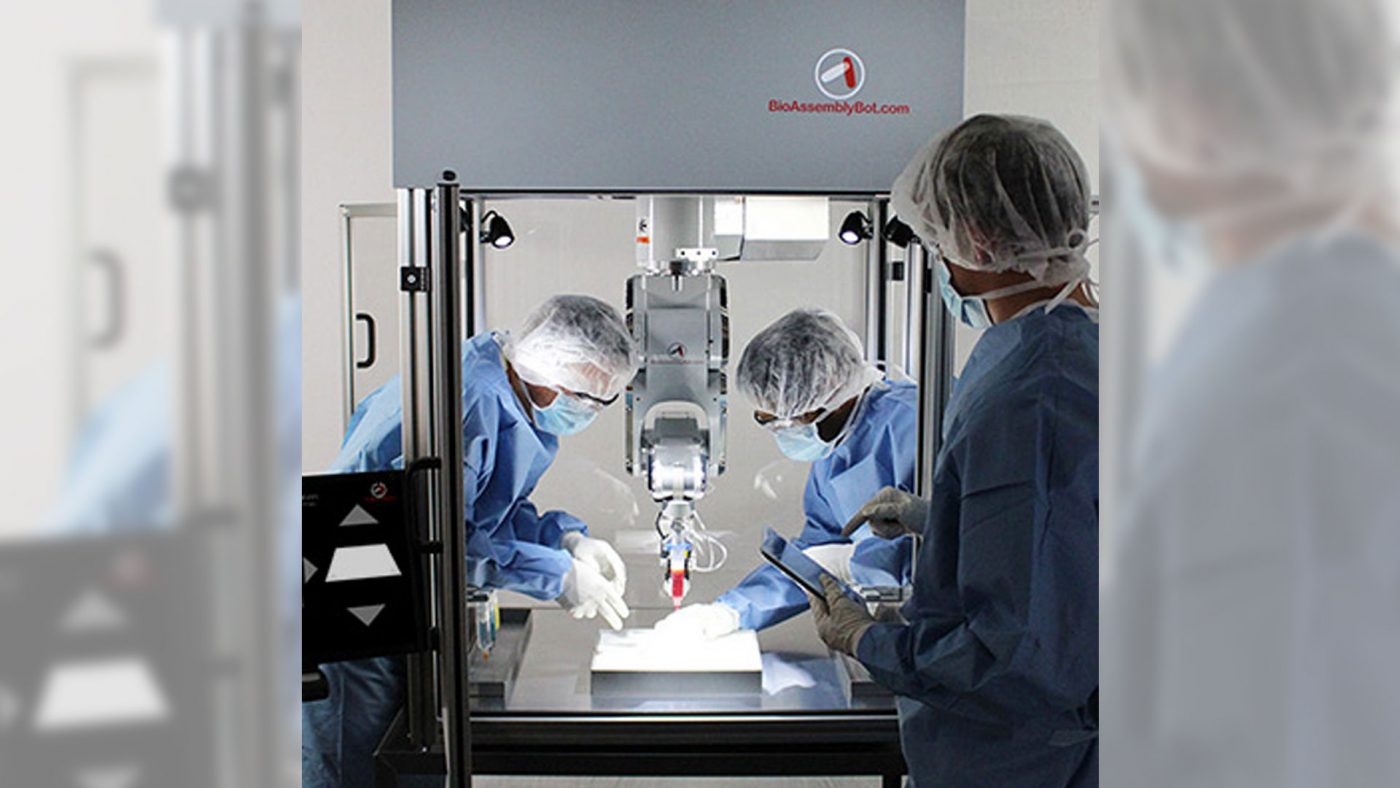 Scientists using the BioAssemblyBot. Photo via Advanced Solutions Life Sciences.