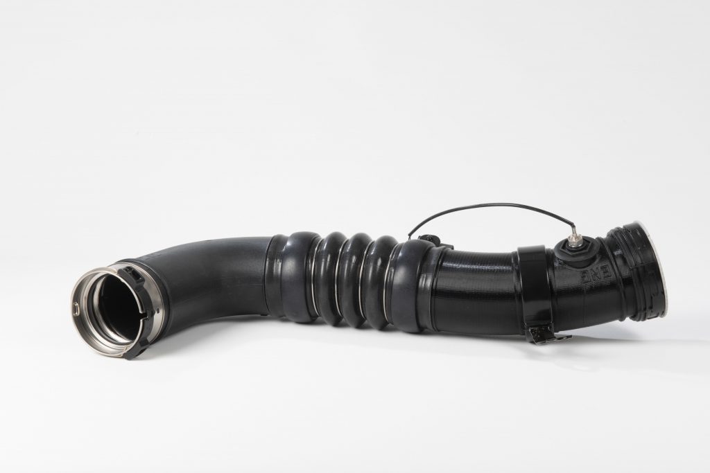 Car part (air pipe), 3D printed using Arnitel ID2060 HT. Photo via DSM.