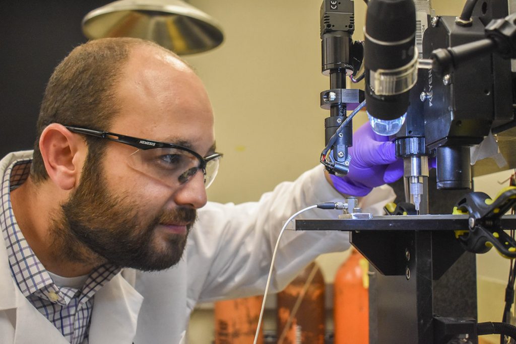 Arda Gozen, assistant professor, WSU School of Mechanical and Materials Engineering, in the Manufacturing Processes and Machinery Lab. Photo via WSU News