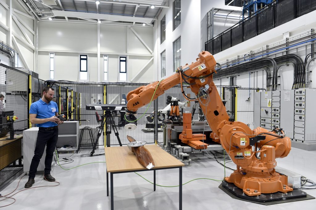 Robots at work in the Centre for Aerospace Manufacturing (CfAM) housed within the AMB. Photo via the University of Nottingham.