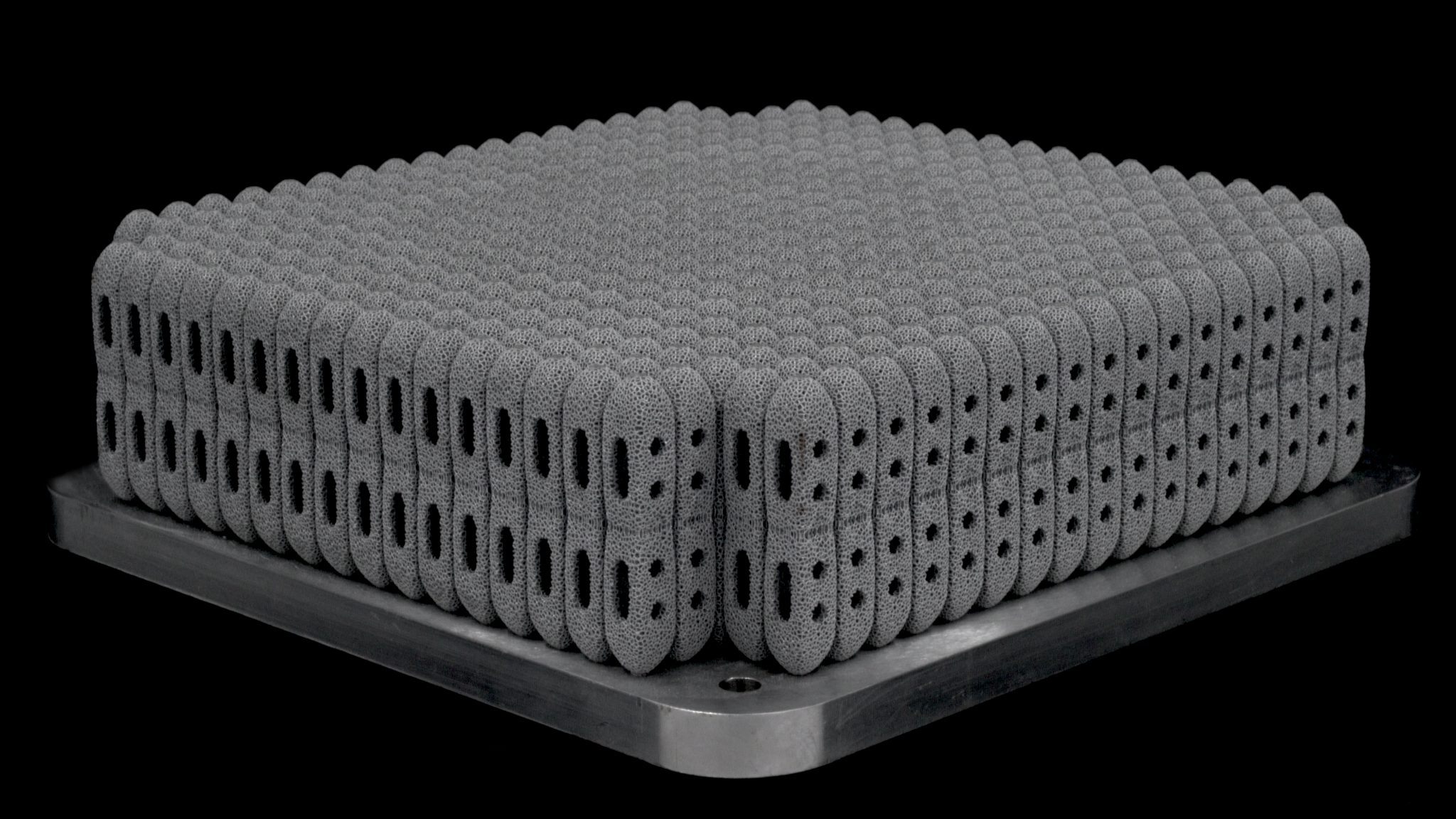 More than 800 posterior lumbar cages 3D printed using a Renishaw RenAM 500Q. Image via Betatype.