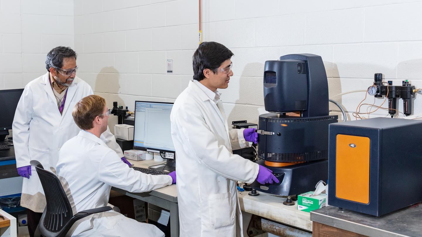 ORNL scientists testing lignin materials. Photo via Oak Ridge National Laboratory