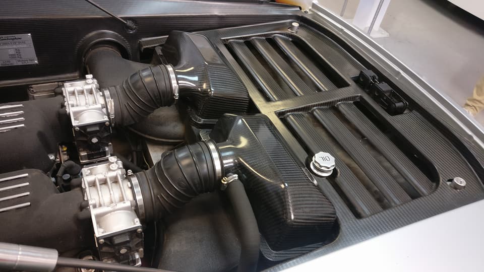 Finished carbon fiber components for the inside of a car. Photo via Dash-CAE