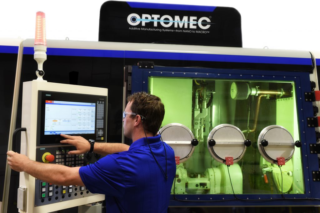 The Optomec LENS 860 closed atmosphere hybrid additive manufacturing system. Photo via Optomec