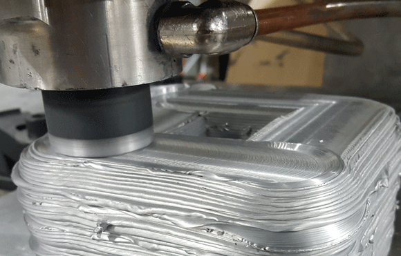 The patented MELD solid-state process. Photo via MELD Manufacturing.