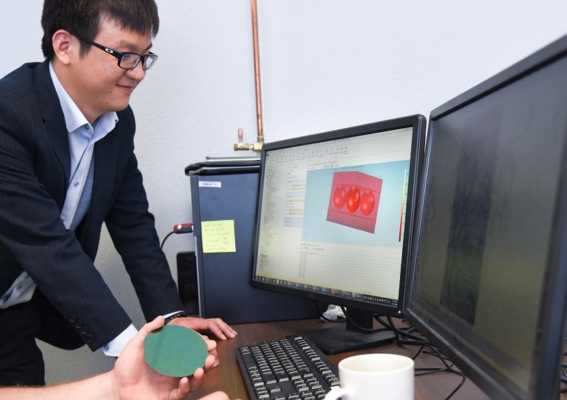 Professor Wenchao Zhou working in the AM³ Lab. Photo via University of Arkansas.