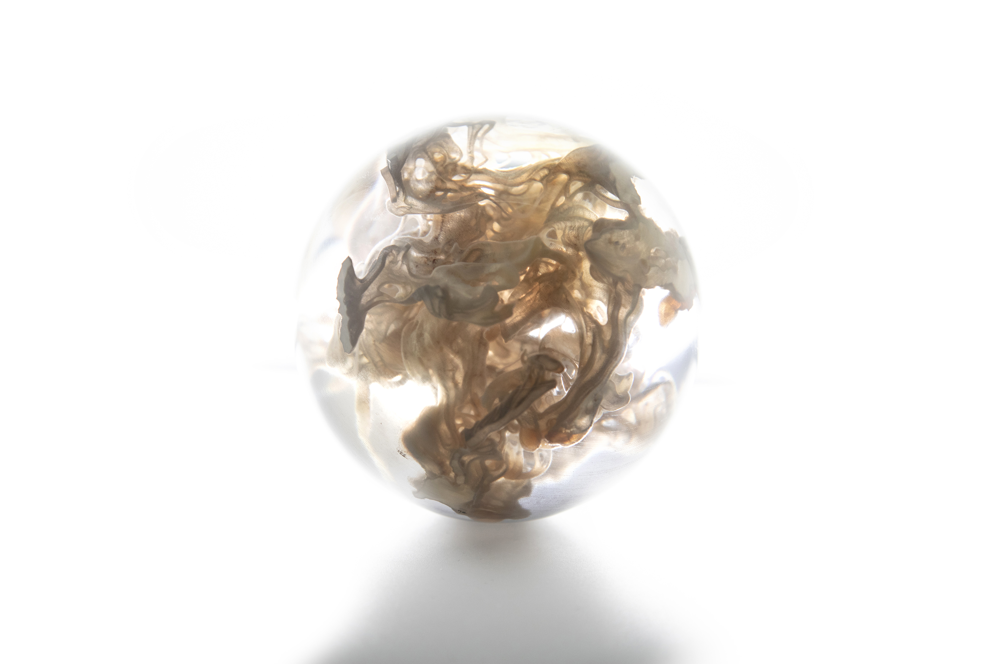 3D printed orbs containing liquid melanin. Image via Neri Oxman and the Mediated Matter Group.