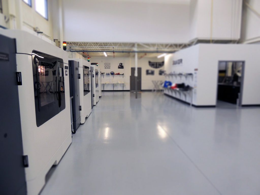 Inside the 3D printing lab at Baker Industries. Photo via Baker Industries