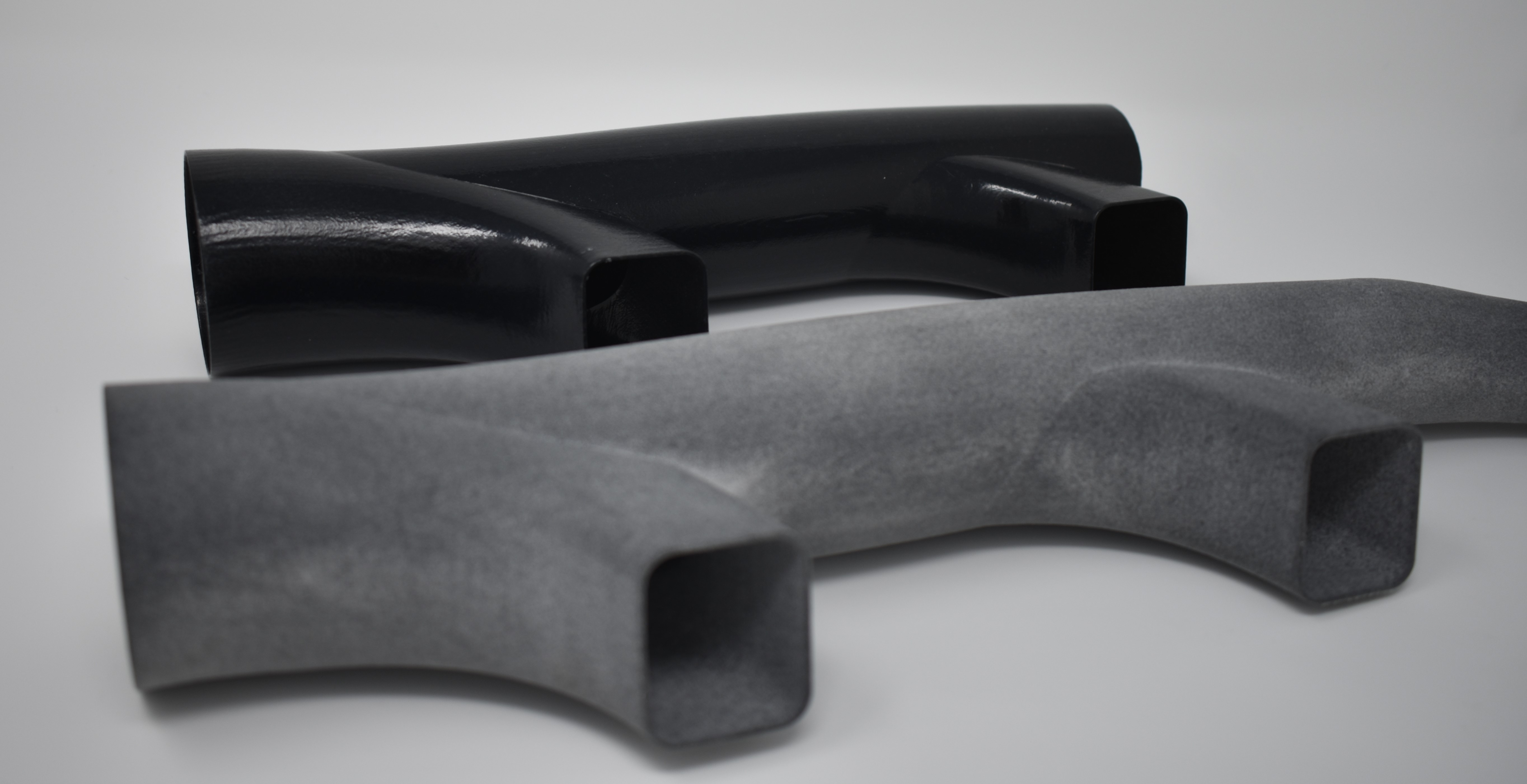 Before and after of a post-processed automotive duct 3D printed using HP Nylon 12. Photo via AMT.