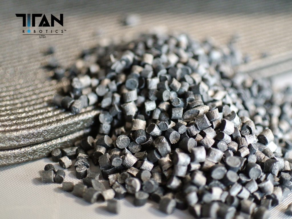 Pelletized feedstock for Titan Robotics' 3D printers. Photo via Titan Robotics