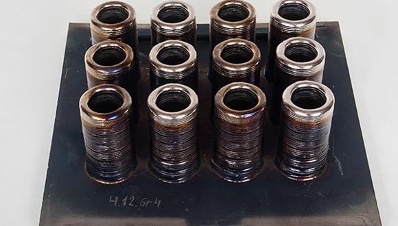 A set of 3D printed cylinders produced on the xBeam system. Photo via Chervona Hvilya.