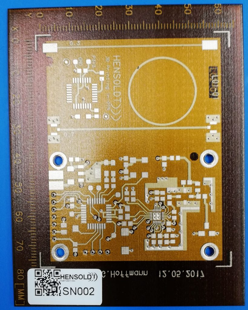 A HENSOLDT Test circuit board 3D printed on the DragonFly LDM. Photo via Nano Dimension
