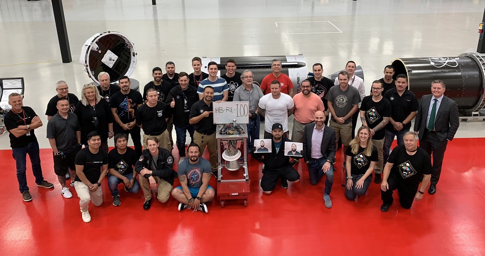 The team of Rocket Lab celebrating the 100th 3D print of the Rutherford engine. Image via Rocket Lab.