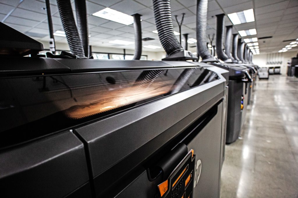 Fleet of HP Multi Jet Fusion 3D printers at FORECAST 3D. Photo via FORECAST 3D