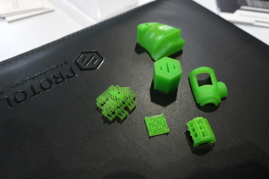 MicroFine Green Resin samples from Protolabs. Photo by Beau Jackson