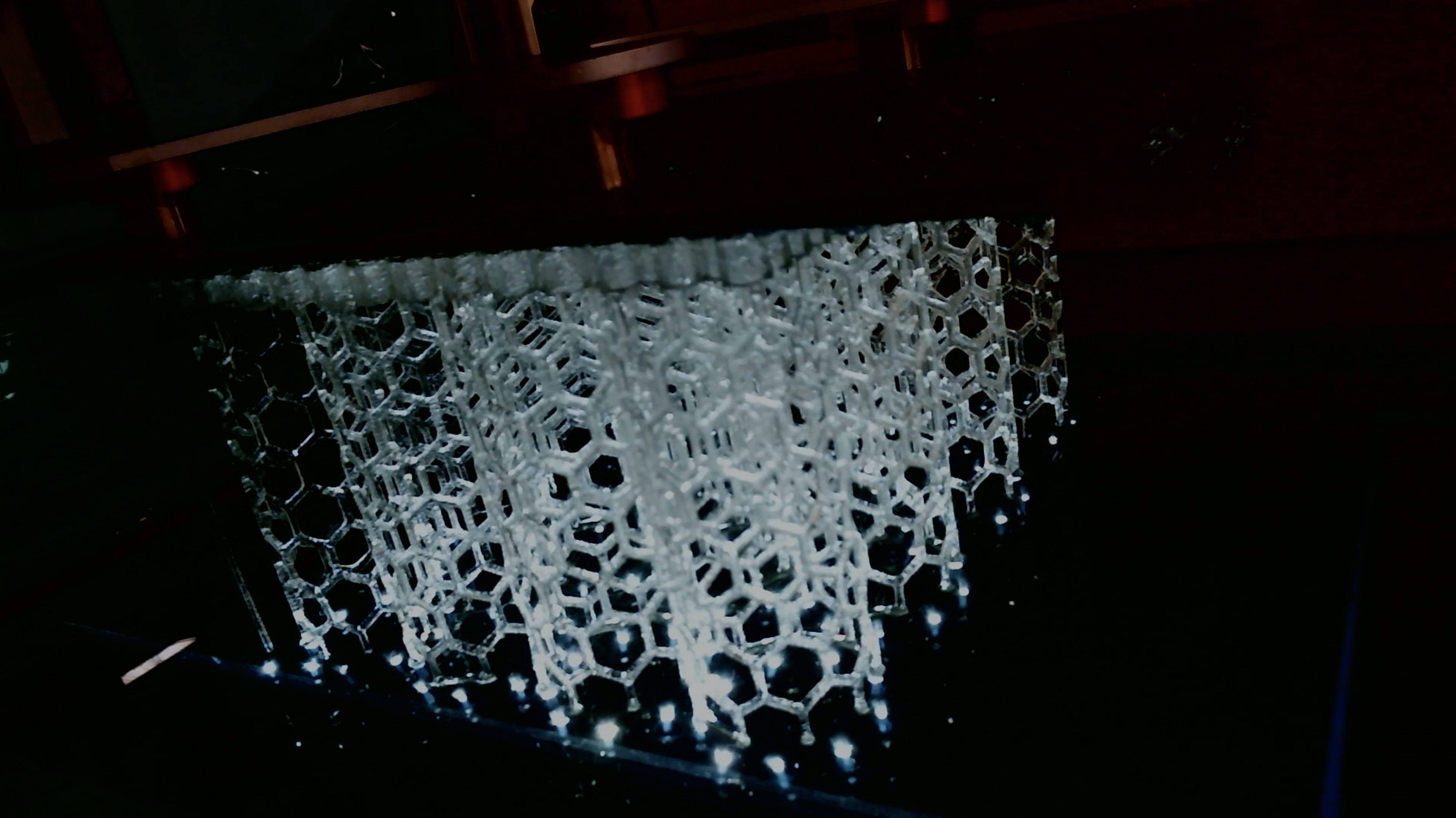 Close-up of 3D printed object emerging from the vat. Photo via Northwestern University.