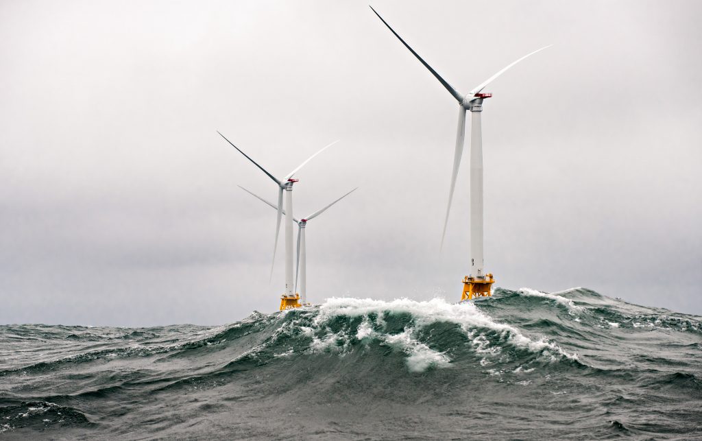 "Heavy seas engulf the Block Island Wind Farm- the first US offshore wind farm. The five Halide 6MW turbines were installed by Deepwater Wind and began producing power in 2016." Photo by Dennis Schroeder / NREL