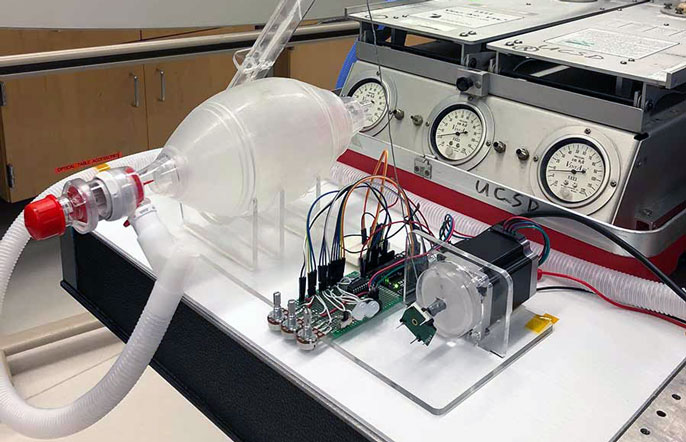 Using 3D printed parts and off-the-shelf components to convert an existing manual ventilator system into an automatic one. Photo via UC San Diego.