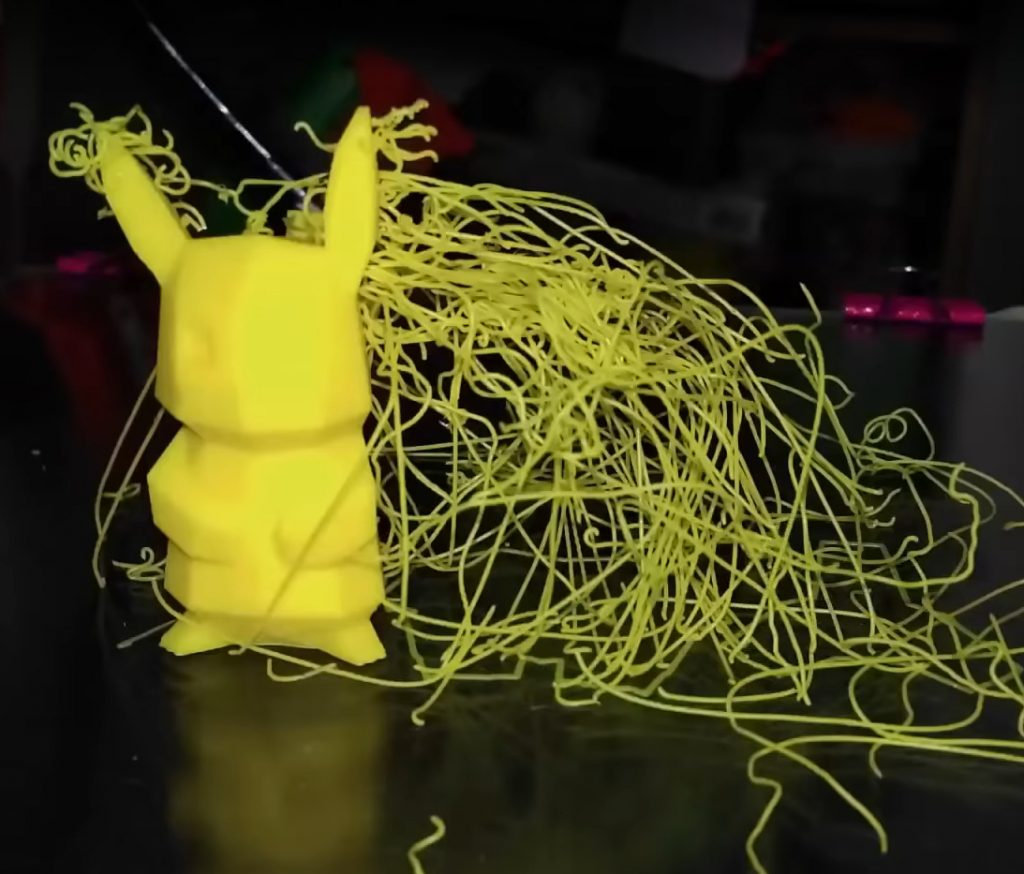 A failed Pikachu print surrounded by spaghetti. Photo via TSD.