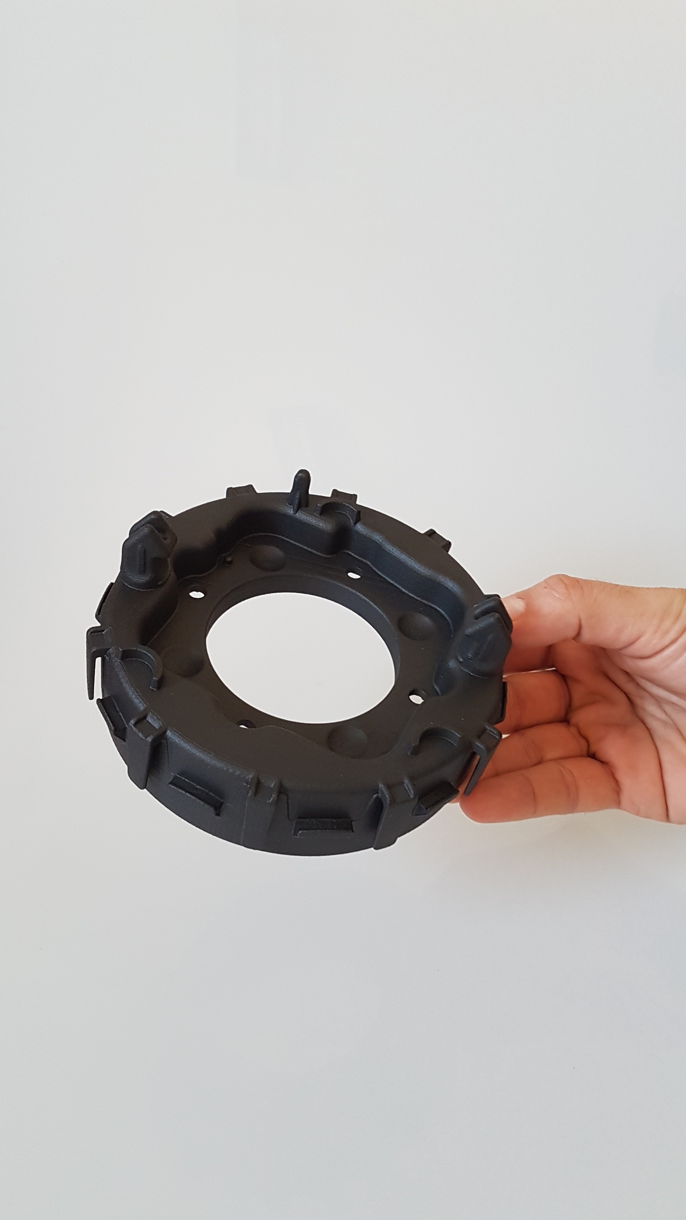 3D printed Driver Airbag (DAB) housing in Windform® SP manufactured via Laser Sintering process. Photo via CRP Technology