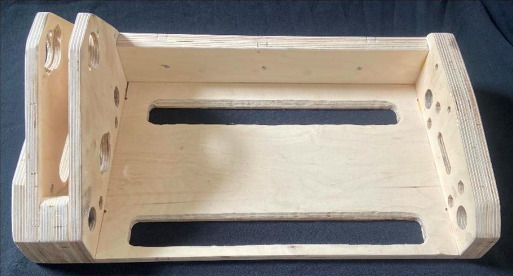 The researchers' screw manufacturing device has been built on a plywood base for cost and functionality purposes. Photo via MDPI.