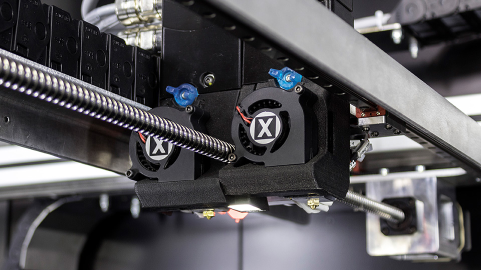 The printer's customizable dual extruders. Photo via Fabbrix.