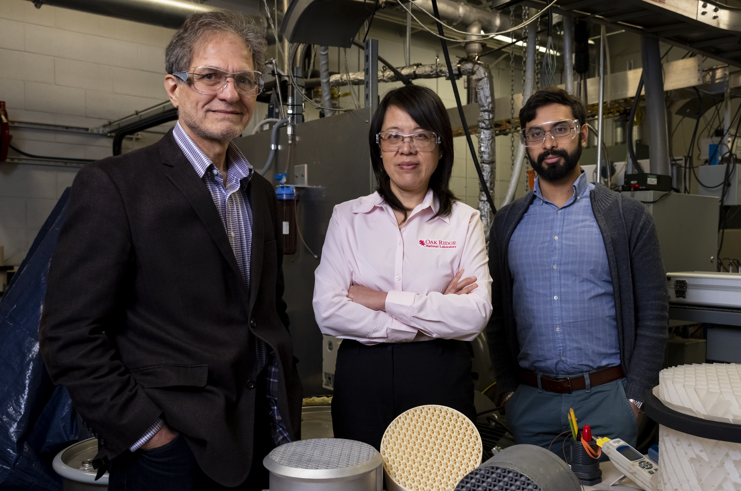 The ORNL researchers (pictured) used 3D printing to optimize their device for carbon dioxide absorbency. Photo via Carlos Jones, ORNL.
