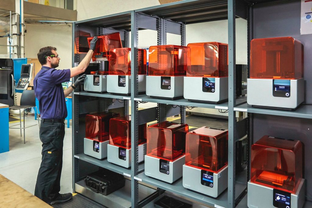 AMRC's printfarm of 12 Formlabs Form 2 3D printers. Photo via AMRC.