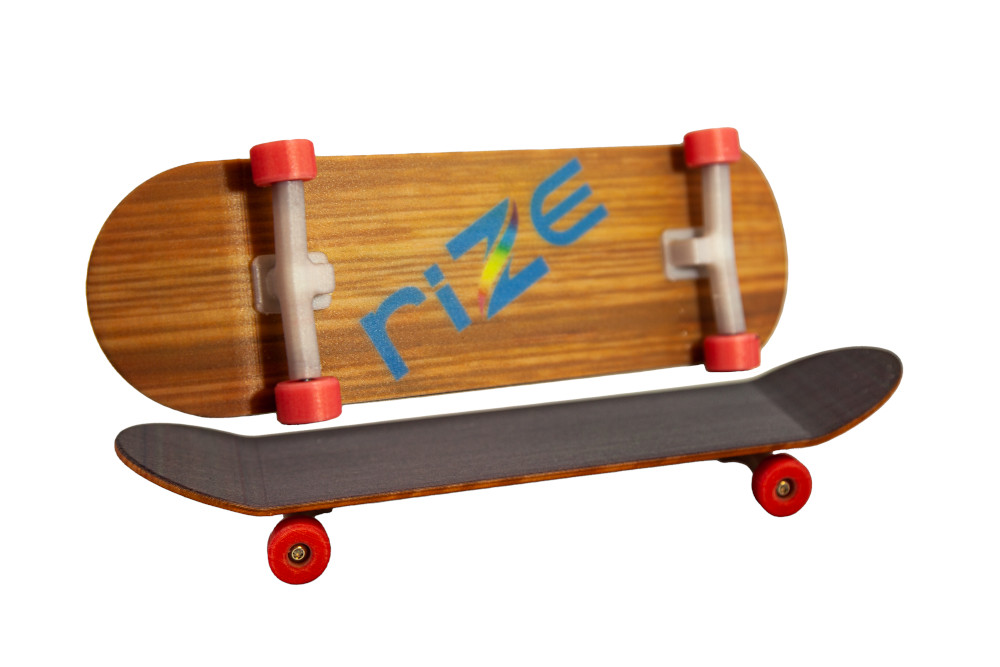 Skateboard 3D printed with RIZIUM fiberglass.  Photo via RIZE.