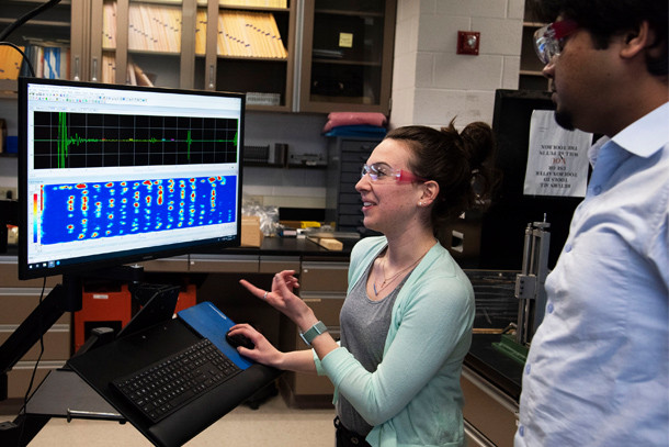 PSU researchers demonstrate the technology used to analyze wave propagation data. Image via Penn State.