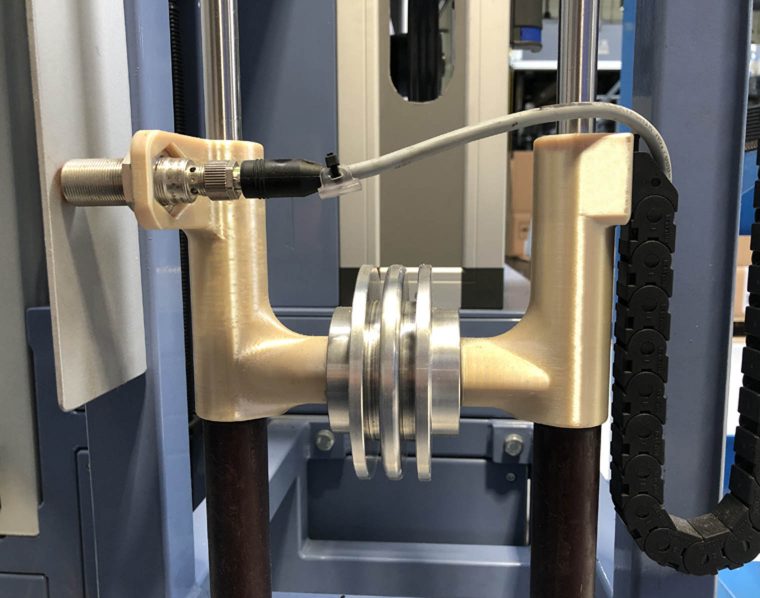 Rustin used its Stratasys Fortus 450mc to create internal production line tooling. The photo above shows weight optimization tool produced in ULTEM™ 9085 resin. Photo via Rustin.