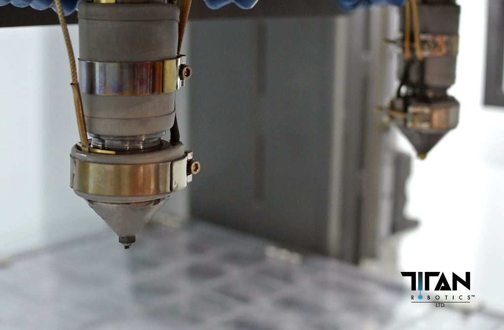 Dual pellet extruders on an Atlas 3D printer. Photo via Titan Robotics.