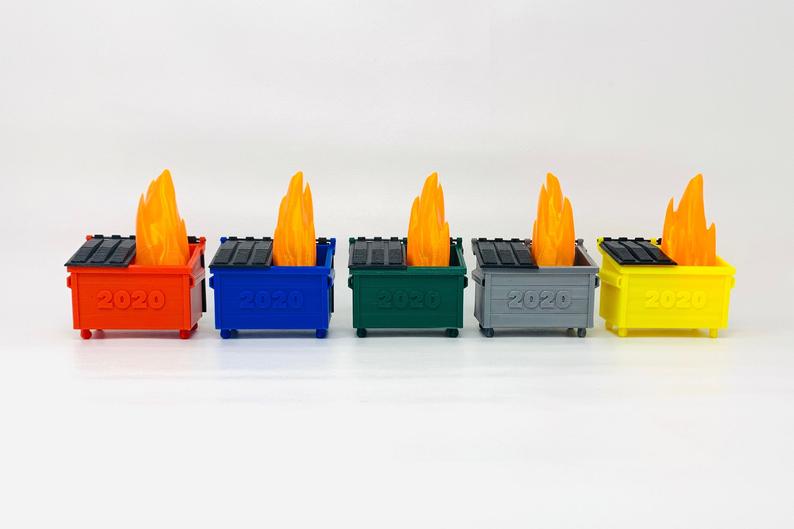 The 3D printed dumpster toys come in five colours and have an LED light. Image via Etsy/RexRoi3D.