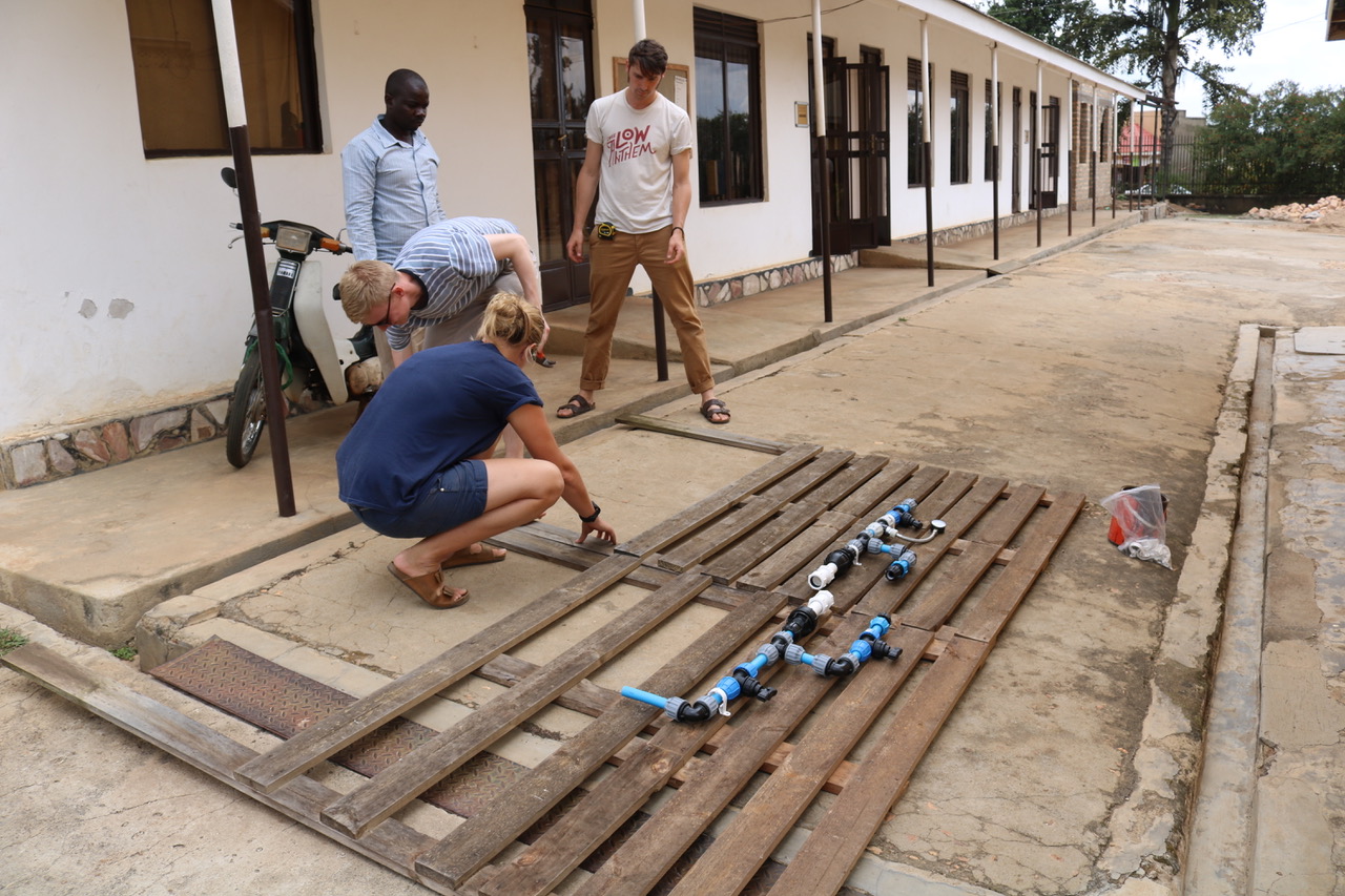 Blue Tap building a test rig for its chlorine doser in 2018 in Uganda. 