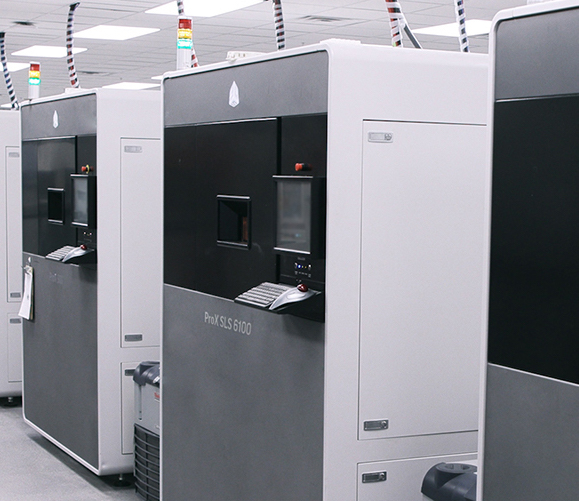 Featured image shows a line of ProX SLS 6100 machines. Photo via 3D Systems.