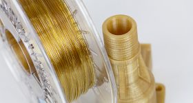 Close up of Kimya's PEKK filament next to 3D printed PEKK object. Photo via 3DGence.