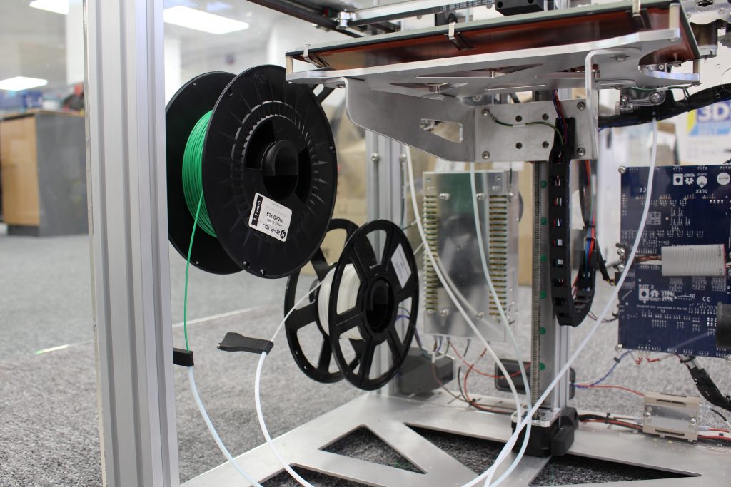 The semi-enclosed build chamber of the E3D. Photo by 3D Printing Industry.