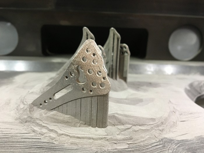 A set of 3D printed radius plate implants made of an amorphous metal. Photo via Heraeus.