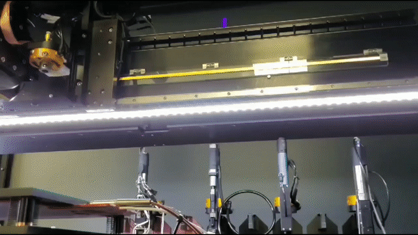 The system's tool changer can be used to switch between the different tool heads. GIF via nScrypt.