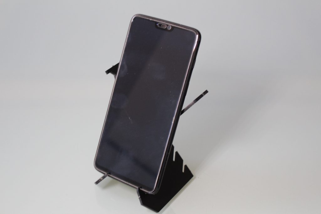 Acrylic CNC machined smartphone holder. Photo by 3D Printing Industry.