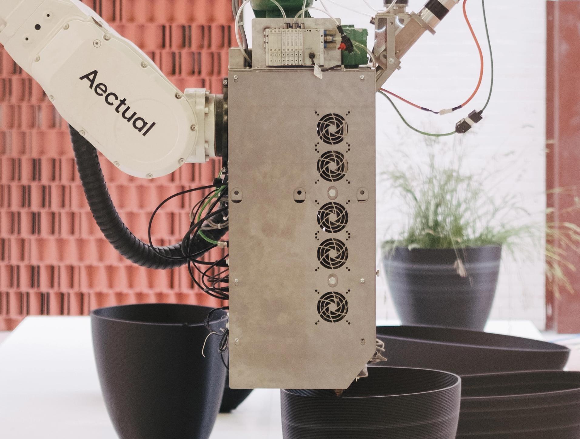 One of Aectual's 3D printers producing an eco-friendly planter.
